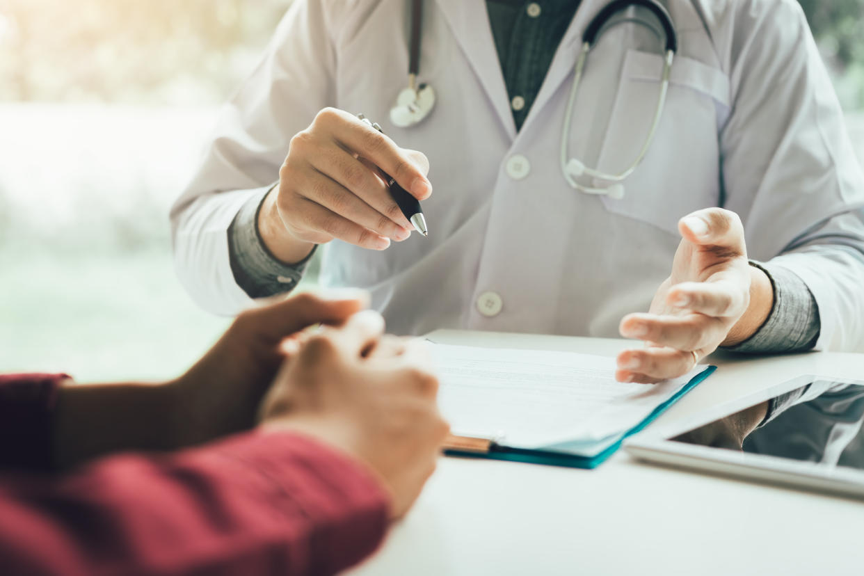 Patient consulting with a doctor. (Photo: Getty Images)