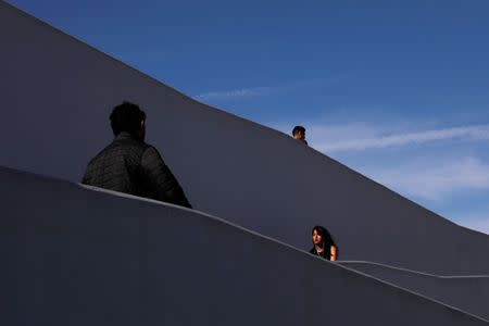 People are seen at Pedwest border crossing entering into to Mexico at the San Ysidro point of entry in Tijuana, Mexico April 3, 2019. REUTERS/Carlos Jasso