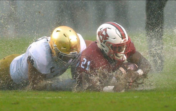 North Carolina State and Notre Dame had to battle each other and Hurricane Matthew's brutal conditions. (Getty)