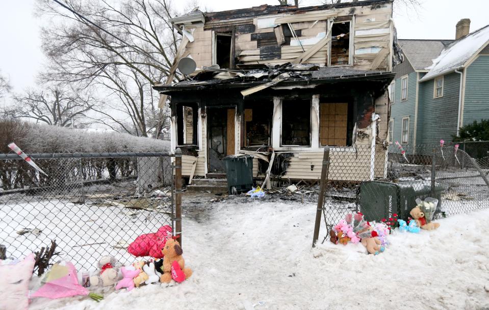 People have created a memorial of stuffed animals, candles and flowers, seen Tuesday, Jan. 23, 2024, at the scene of Sunday’s house fire at 222 N. LaPorte Ave. that killed five children.