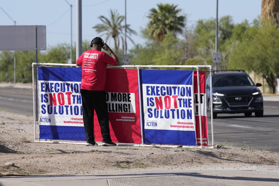 Charles Keith stands outside the state prison Wednesday, May 11, 2022 in Florence, Ariz. Inmate Clarence Dixon is scheduled to die by lethal injection Wednesday inside the state prison for his murder conviction in the killing of 21-year-old Arizona State University student Deana Bowdoin in 1978. Dixon will become the first person to be executed in the state after a nearly eight-year hiatus in its use of the death penalty. (AP Photo/Rick Scuteri)