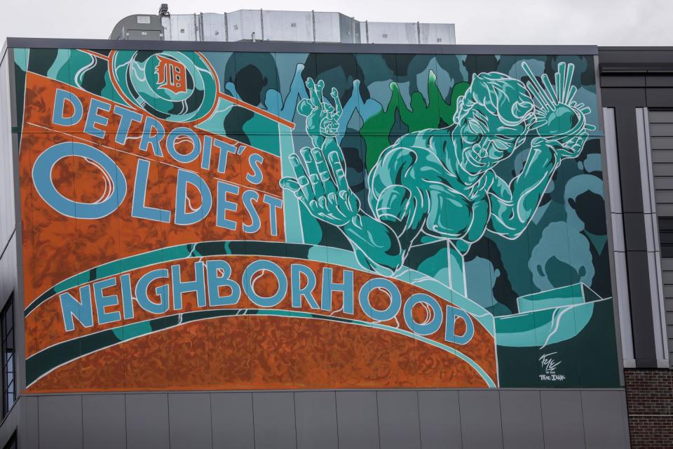 Trae Issac created the mural "The Corktown Tribute" on the Godfrey Hotel in Detroit.