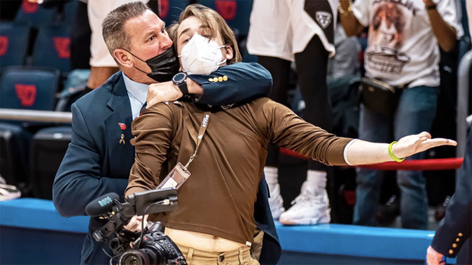 A security guard from the University of Dayton Arena was caught on camera putting a cameraman, who was permitted on court to film post game celebrations, in a chokehold. Picture: Griffin Quinn/Twitter/@griffinpquinn