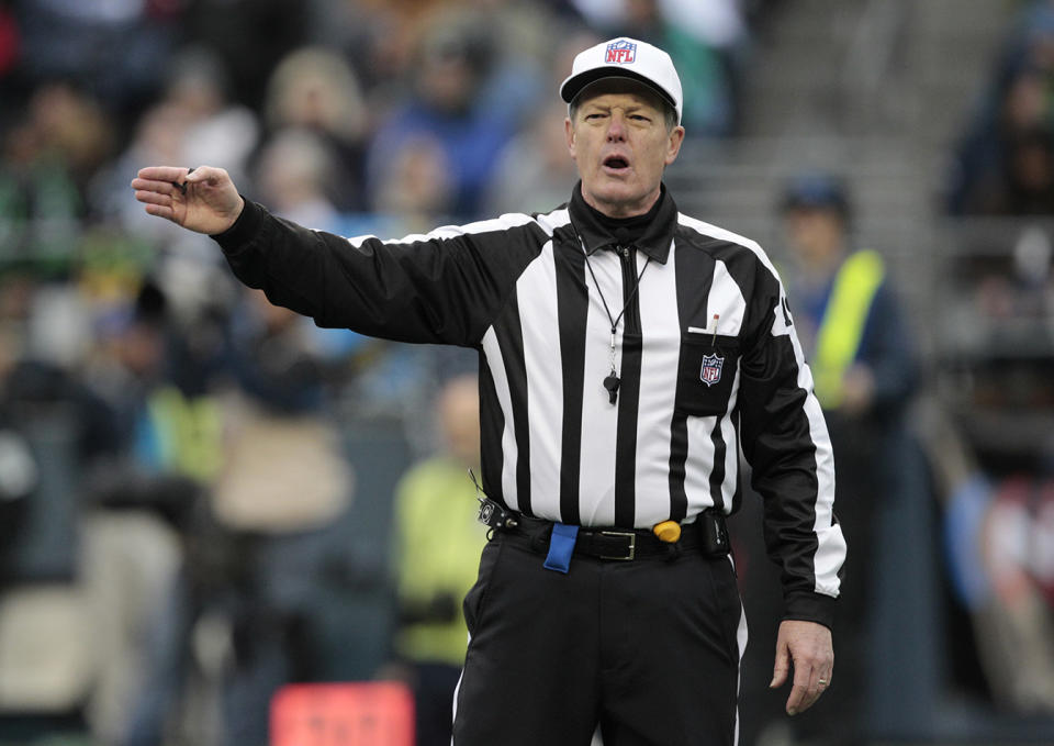 Referee Scott Green makes a call in the second half of the Seattle Seahawks and Baltimore Ravens NFL football game on Nov. 13, 2011, in Seattle.