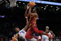 Iowa State's Izaiah Brockington (1) drives over Memphis' Earl Timberlake (0) during the first half of an NCAA college basketball game in the NIT Season Tip-Off tournament Friday, Nov. 26, 2021, in New York. Brockington was called for a foul. (AP Photo/Adam Hunger)