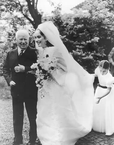 <p>Daily Express/Archive Photos/Getty</p> Charlie Chaplin and daughter Josephine on her wedding day, June 23, 1969