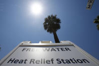 <p>A Salvation Army hydration station sign gets hit by the midday sun as temperatures climb to near-record highs, June 19, 2017, in Phoenix. (Ross D. Franklin/AP) </p>