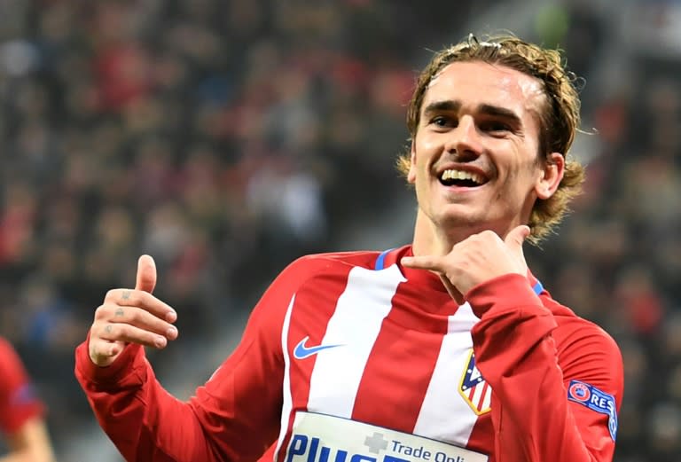 Atletico Madrid's forward Antoine Griezmann celebrates after scoringl during the Champions League round of 16 first-leg football match against Bayer 04 Leverkusen February 21, 2017