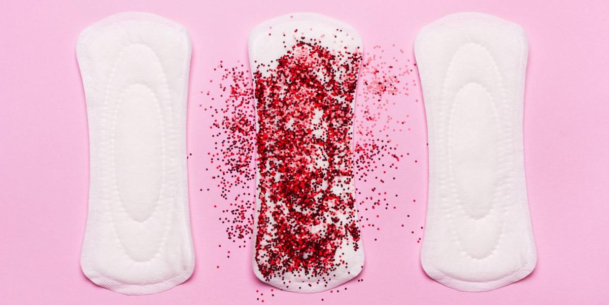 Symptom of endometriosis, menstrual blood with blood clots on a sanitary  pad. Stock Photo