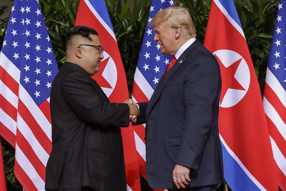 President Donald Trump shakes hands with North Korea leader Kim Jong Un during the start of their first summit on June 12, 2018 in Singapore.