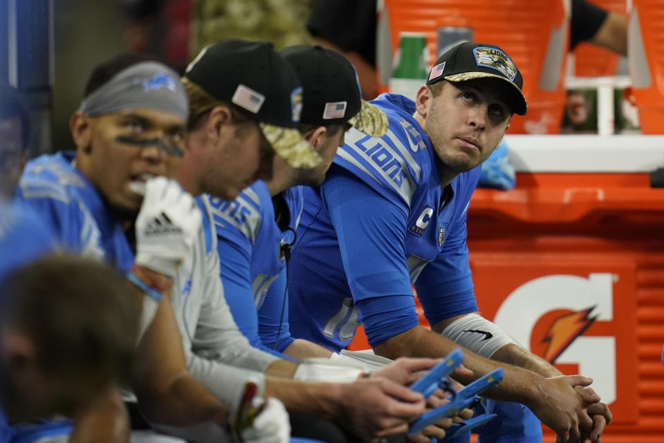 Detroit Lions quarterback Jared Goff, far right, and teammates sit on the bench during the second half of an NFL football game against the Philadelphia Eagles, Sunday, Oct. 31, 2021, in Detroit. (AP Photo/Paul Sancya)