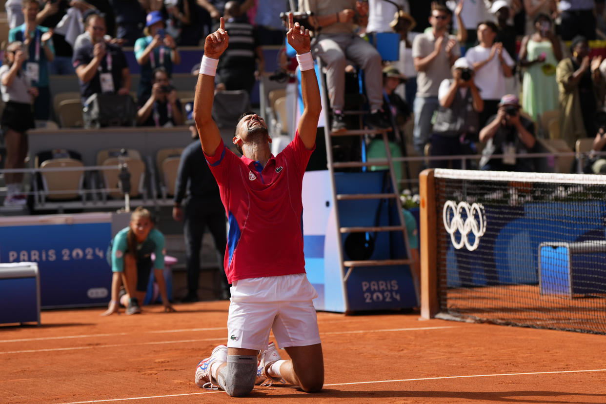 Serbia's Novak Djokovic reacts after defeating Spain's Carlos Alcaraz in the men's singles tennis final  during the Summer Olympics on Sunday. 