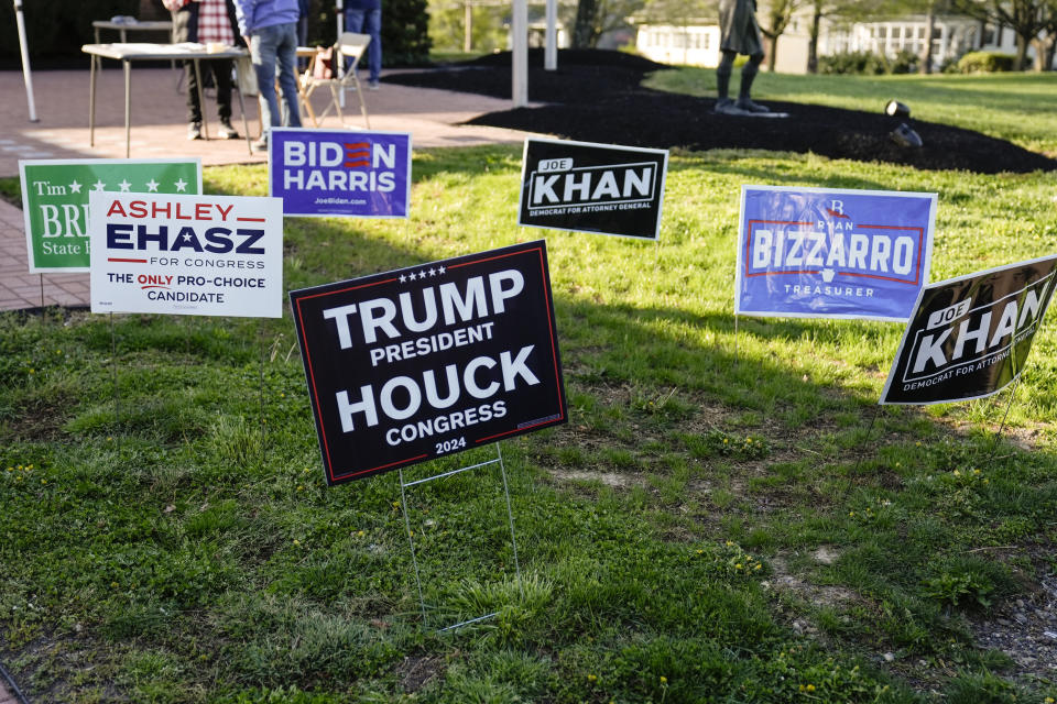 Campaign signs are posted outside of a polling site in Doylestown, Pa., Tuesday, April 23, 2024. (AP Photo/Matt Rourke)