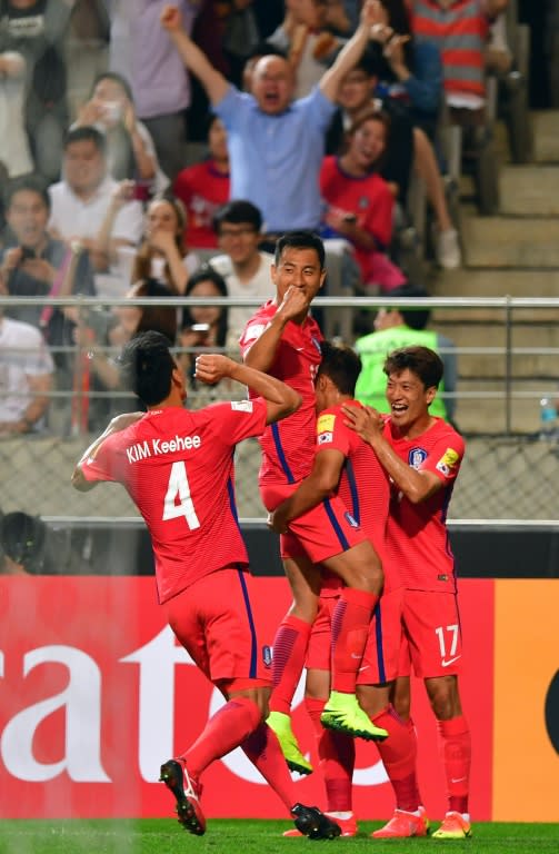 South Korean players celebrate a Chinese own goal in their World Cup qualifier in Seoul on September 1, 2016