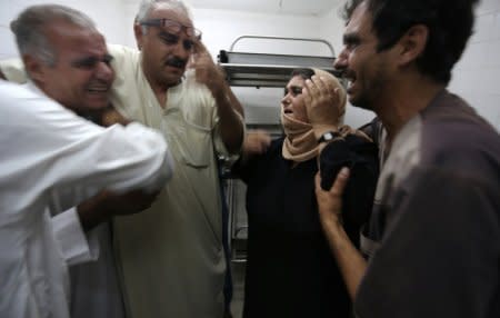 The mother of a Palestinian who was killed by Israeli troops east of Khan Younis reacts at hospital in Gaza Strip July 20, 2018. REUTERS/Ibraheem Abu Mustafa