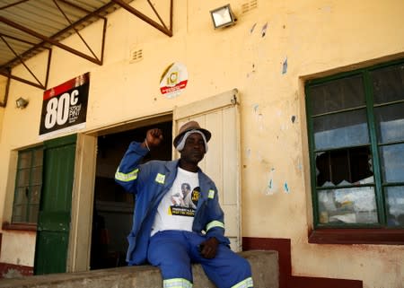 Richard Shumba, supporter of former Zimbabwe President Robert Mugabe, gestures at rural Kutama village