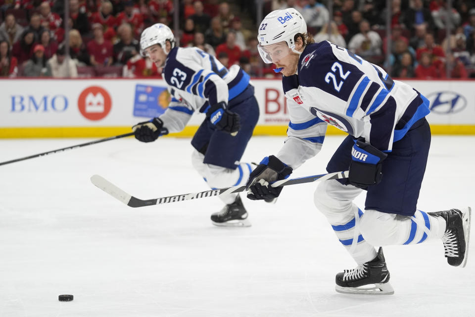 Winnipeg Jets center Mason Appleton (22) handles the puck during the second period of an NHL hockey game against the Chicago Blackhawks, Friday, Feb. 23, 2024, in Chicago. (AP Photo/Erin Hooley)
