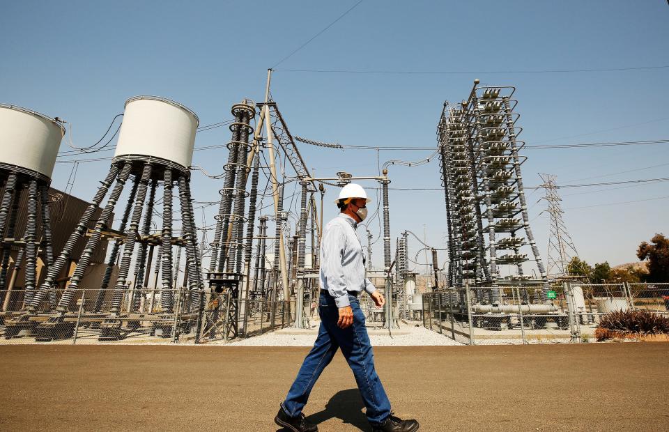 A man walks through a power station