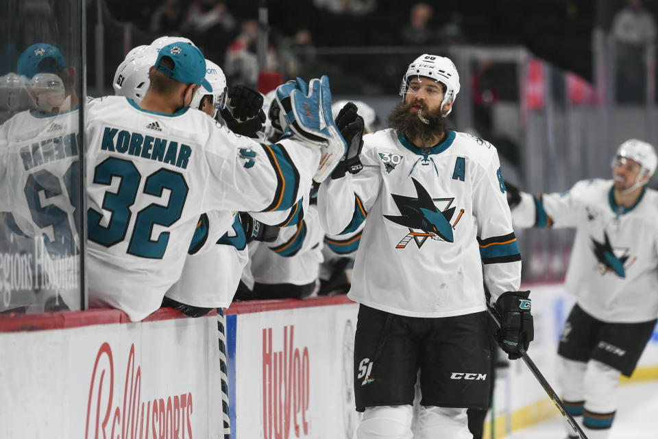 San Jose Sharks defenseman Brent Burns celebrates with the bench after scoring a goal against the Minnesota Wild during the first period of an NHL hockey game Saturday, April 17, 2021, in St. Paul, Minn. (AP Photo/Craig Lassig)