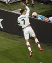 Portugal's Cristiano Ronaldo celebrates his side's second goal during the Euro 2020 soccer championship group F match between Hungary and Portugal at the Ferenc Puskas stadium in Budapest, Hungary, Tuesday, June 15, 2021. (AP Photo/Laszlo Balogh, Pool)