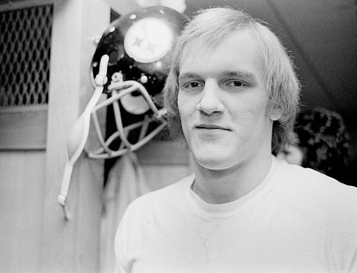 Steelers linebacker Jack Lambert is shown in Three Rivers Stadium locker room in Pittsburgh before an AFC playoff game against the Oakland Raiders, Jan. 4, 1976. Lambert, the Associated Press Defensive Rookie of the Year, was a three-year letterman at Kent State.