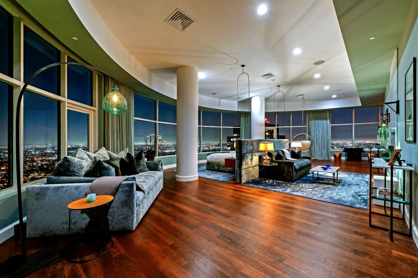 After finding no takes at $35 million, Matthew Perry is now asking $27 million for his penthouse at the Century building in Century City. Called "Mansion in the Sky," Perry's penthouse has about 9,300 square feet of living space, a custom screening room and a center-island kitchen. Perry purchased the residence three years ago and worked with architect Scott Joyce and designer LM Pagano to transform the living spaces. New details include subdued colors, textured accents and modern fixtures. The screening room is awash in a plush material. (Michael MaNamara and Jason Speth)