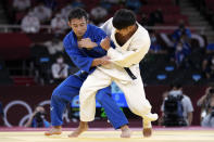 THIS CORRECTS TO GOLD, NOT BRONZE - Naohisa Takato of Japan, left, and Yang Yung-wei of Taiwan compete during their men's -60kg gold medal judo match at the 2020 Summer Olympics, Saturday, July 24, 2021, in Tokyo, Japan. (AP Photo/Vincent Thian)