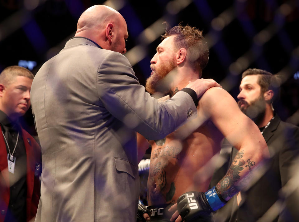 UFC president Dana White (L) tries to calm Conor McGregor following his loss to lightweight champion Khabib Nurmagomedov at UFC 229 in Las Vegas. (Getty Images)