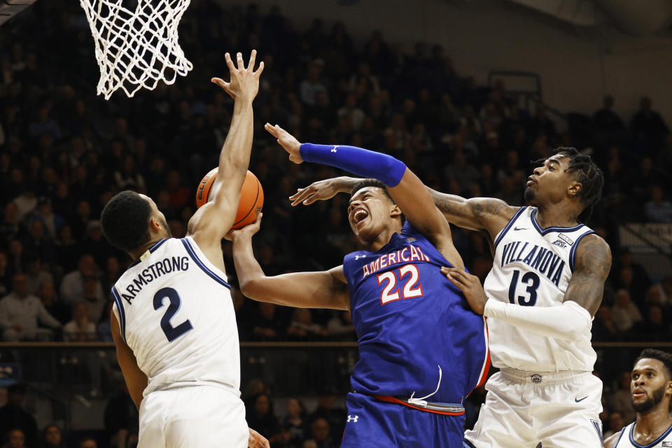 Villanova guard Mark Armstrong (2) and guard Hakim Hart (13) block a shot by American center Jermaine Ballisager Webb (22) during the first half of an NCAA college basketball game, Monday, Nov. 6, 2023, in Villanova, Pa. (AP Photo/Laurence Kesterson)