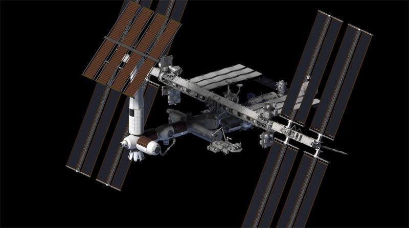 Axiom plans to attach modules to the International Space Station, seen extending to the left of the lab in this artist's impression, that later could be detached to fly as an independent, commercial outpost after the current spacelab is retired. / Credit: Axiom Space