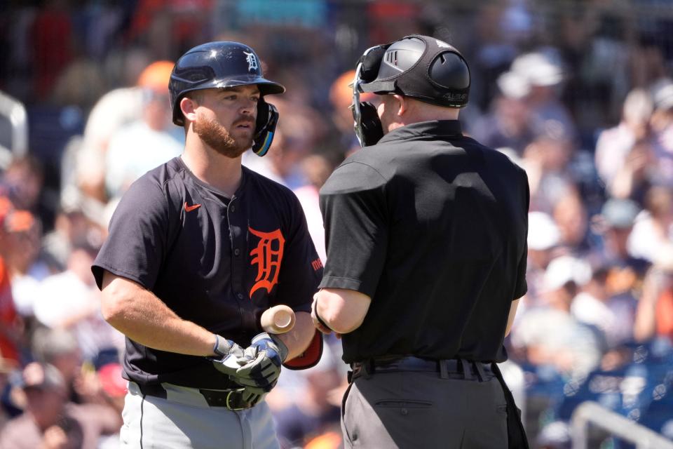 Detroit Tigers' Jake Rogers, left, talks with home plate umpire Mike Estabrook after being called out on strikes during the second inning against the Houston Astros at CACTI Park of the Palm Beaches in West Palm Beach, Florida, on Monday, March 11, 2024.