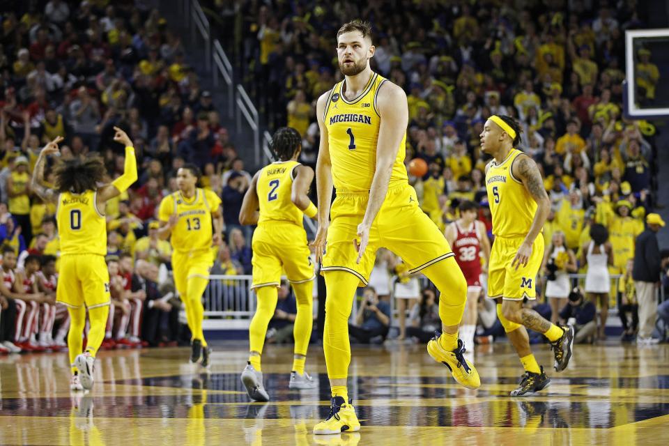 Michigan center Hunter Dickinson reacts after making a 3-pointer during the first half on Saturday, Feb. 11, 2023, at Crisler Center.