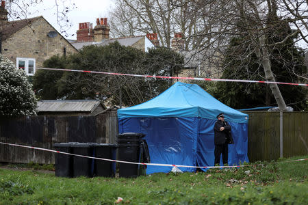 A policeman stands guard outside a forensics tent at a property where the body of Laureline Garcia-Bertaux was found in Kew, London, Britain March 7, 2019. REUTERS/Simon Dawson