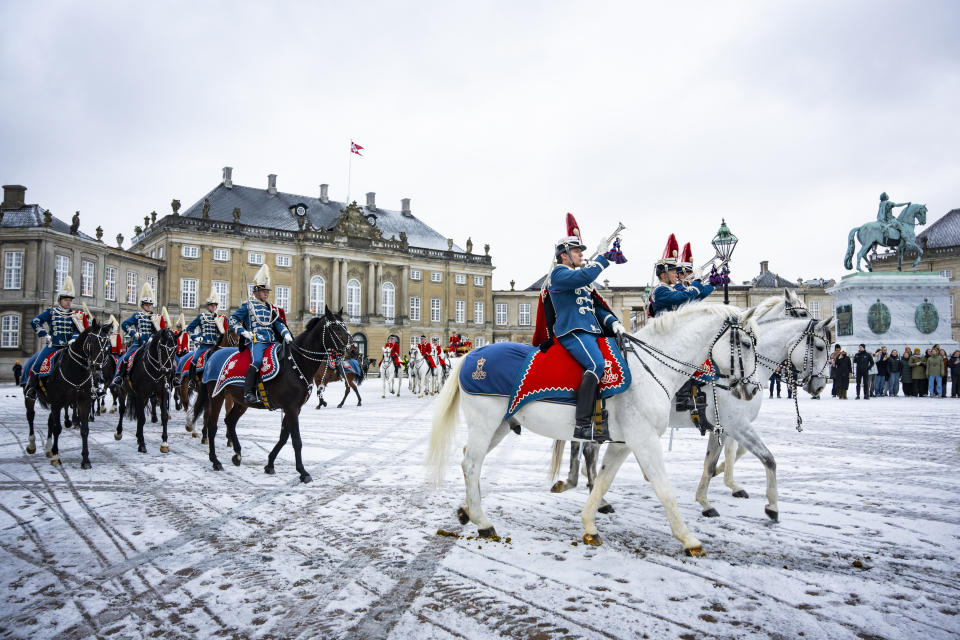 The Hussar Regiment escorts Denmark's Queen Margrethe as she rides in a horse-drawn coach from Christian IX's Palace, Amalienborg to Christiansborg Palace in Copenhagen, Denmark, Thursday Jan. 4, 2024. Europe's longest reigning monarch Queen Margrethe rode through Denmark’s capital Thursday in a gilded, horse-drawn coach as she concluded her last New Year celebrations before her abdication later this month. (Emil Nicolai Helms/Ritzau Scanpix via AP)