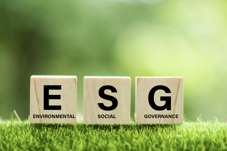 words ESG on a wood block and Future environmental conservation and sustainable ESG modernization development by using the technology of renewable resources to reduce pollution and carbon emission.