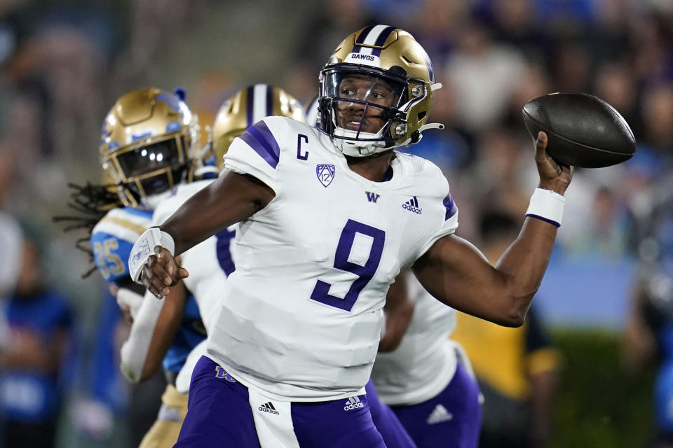 Washington quarterback Michael Penix Jr. throws a pass against UCLA during the first half of an NCAA college football game Friday, Sept. 30, 2022, in Pasadena, Calif. (AP Photo/Marcio Jose Sanchez)