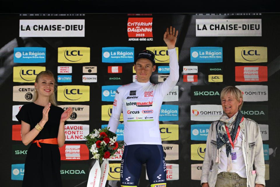 LA CHAISEDIEU FRANCE  JUNE 05 Rune Herregodts of Belgium and Team Intermarch  Circus  Wanty  White Best Young Rider Jersey celebrates at podium during the 75th Criterium du Dauphine 2023 Stage 2 a 1673km stage from BrassaclesMines to La ChaiseDieu 1080m  UCIWT  on June 05 2023 in La ChaiseDieu France Photo by Dario BelingheriGetty Images