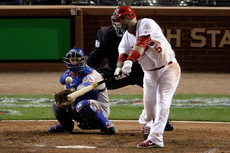 ST LOUIS, MO - OCTOBER 27: Albert Pujols #5 of the St. Louis Cardinals hits a double in the ninth inning during Game Six of the MLB World Series against the Texas Rangers at Busch Stadium on October 27, 2011 in St Louis, Missouri. (Photo by Rob Carr/Getty Images)