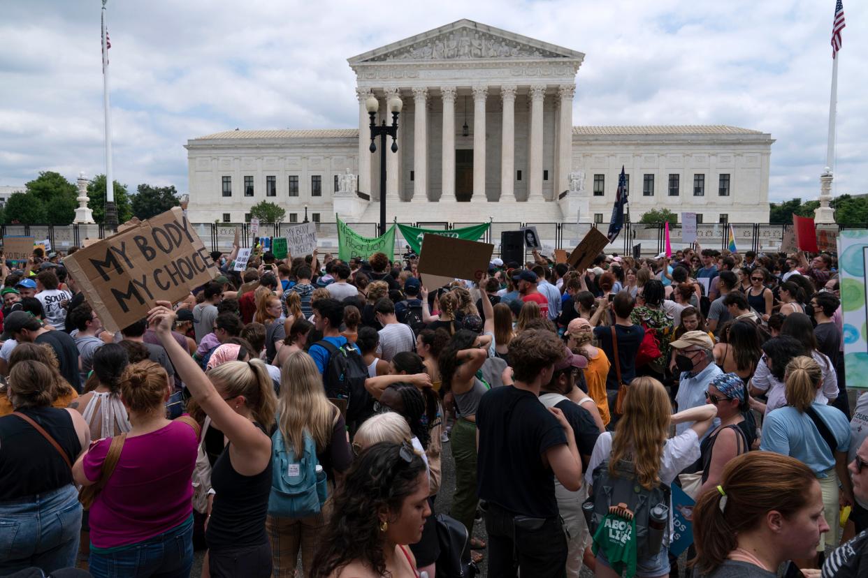 Abortion-rights protesters gather outside the Supreme Court in Washington, D.C., on  June 24. The Supreme Court has ended constitutional protections for abortion that had been in place nearly 50 years, a decision by its conservative majority to overturn the court's landmark abortion cases.