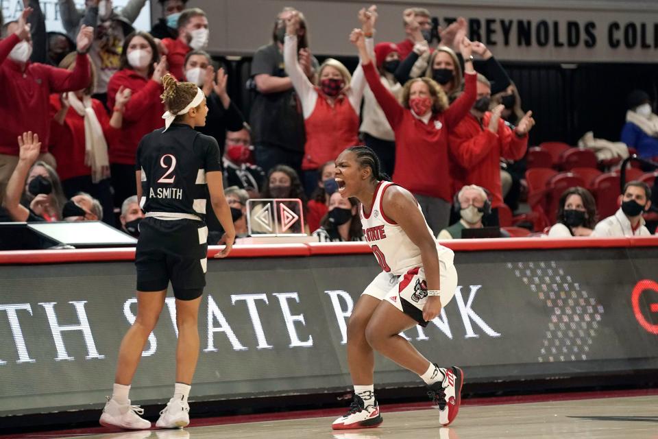 NC State guard Diamond Johnson celebrates after draining a 3-pointer during the fourth quarter of the fourth-ranked Wolfpack's 68-59 win over No. 3 Louisville on Thursday in Raleigh. NC State outscored Louisville 31-8 in the fourth quarter, rallying from a 16-point deficit for the win.
