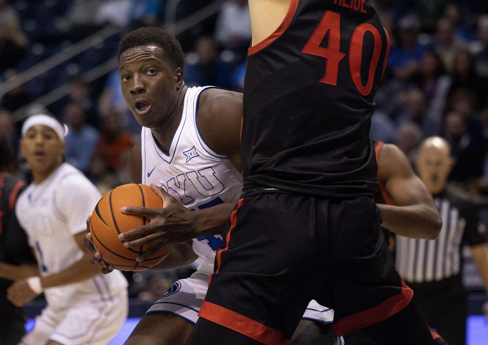 Brigham Young Cougars forward Fousseyni Traore (45) drives into San Diego State Aztecs forward Miles Heide (40) at BYU’s Marriott Center in Provo on Friday, Nov. 10, 2023. | Laura Seitz, Deseret News