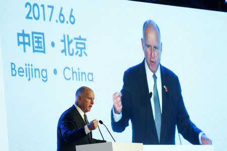 California Governor Jerry Brown attends International Forum on Electric Vehicle Pilot Cities and Industrial Development in Beijing, China June 6, 2017. REUTERS/Thomas Peter