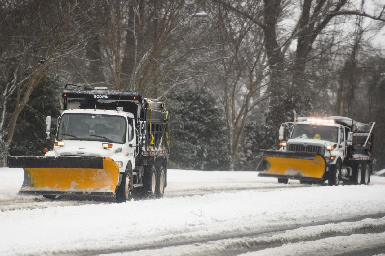 SCDOT plow trucks drive down Pete Hollis Boulevard Thursday, Jan. 16, 2022.