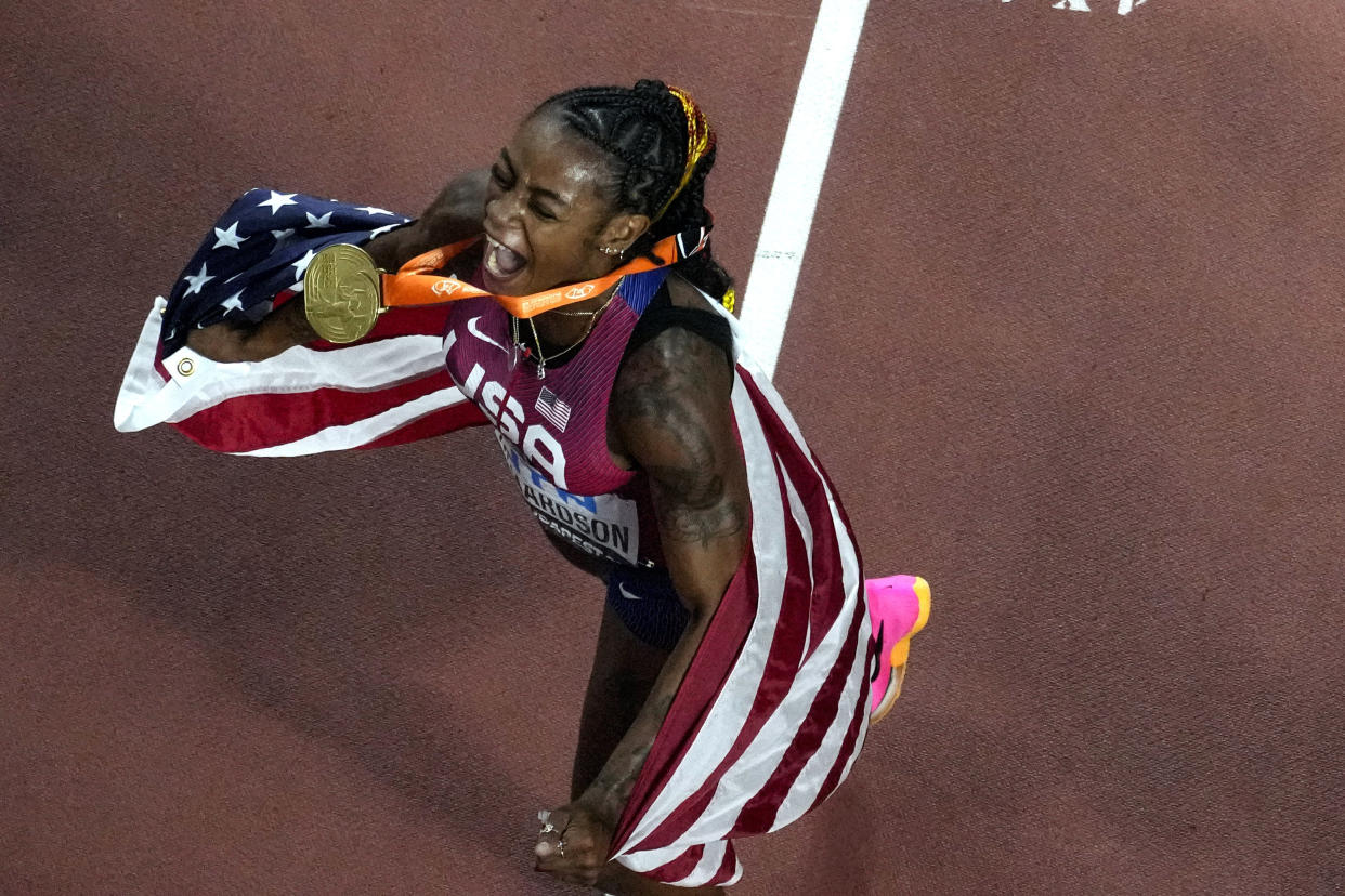 Sha'Carri Richardson, of the United States, celebrates after winning the Women's 100-meters final during the World Athletics Championships in Budapest, Hungary, Monday, Aug. 21, 2023. (AP Photo/David J. Phillip)