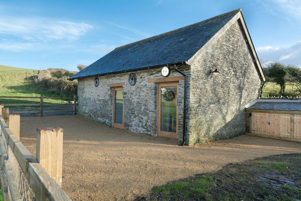 <p>With Woolacombe Bay just around the corner, this cosy Christmas cottage is the perfect festive getaway for couples who love the coast. Once a 19th-century farm linhay, Gordon Cabin has been carefully restored and now you’ll find an atmospheric open-plan space for two people, with tall beamed ceilings and contemporary interior styling. </p><p><strong>Be sure to...</strong> explore the surroundings. It sits in an elevated position in the tiny village of Mortehoe with its 13th-century church and traditional pubs. You’ll view the sea in the distance and the wild and remote coastline wraps around this beautiful village.</p><p><strong>Sleeps: </strong>2 + 1 dog</p><p><strong>Price: </strong>From £524 for 4 nights</p><p><a class="link " href="https://go.redirectingat.com?id=127X1599956&url=https%3A%2F%2Fwww.nationaltrust.org.uk%2Fholidays%2Fgordons-cabin-devon&sref=https%3A%2F%2Fwww.countryliving.com%2Fuk%2Ftravel-ideas%2Fstaycation-uk%2Fg33888029%2Fchristmas-cottage%2F" rel="nofollow noopener" target="_blank" data-ylk="slk:FIND OUT MORE;elm:context_link;itc:0;sec:content-canvas">FIND OUT MORE</a></p>