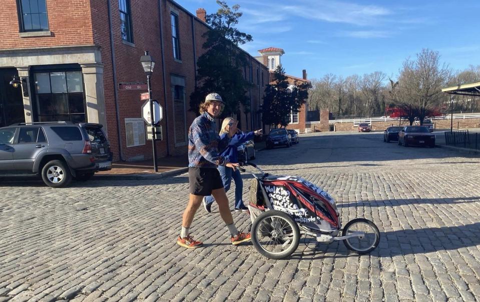 Holden Minor Ringer and columnist Kristi K. Higgins stroll on East Old Street, a historic cobblestone road, in Petersburg.