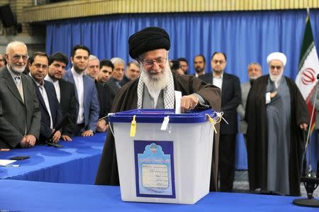 Iran's Supreme Leader Ayatollah Ali Khamenei casts his vote during elections for the parliament and Assembly of Experts, which has the power to appoint and dismiss the supreme leader, in Tehran February 26, 2016. REUTERS/leader.ir/Handout via Reuters