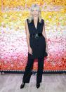 <p>Karlie Kloss wore a navy pinstripe sleeveless jacket and trousers to attend the Bumble Dinner Party.</p>