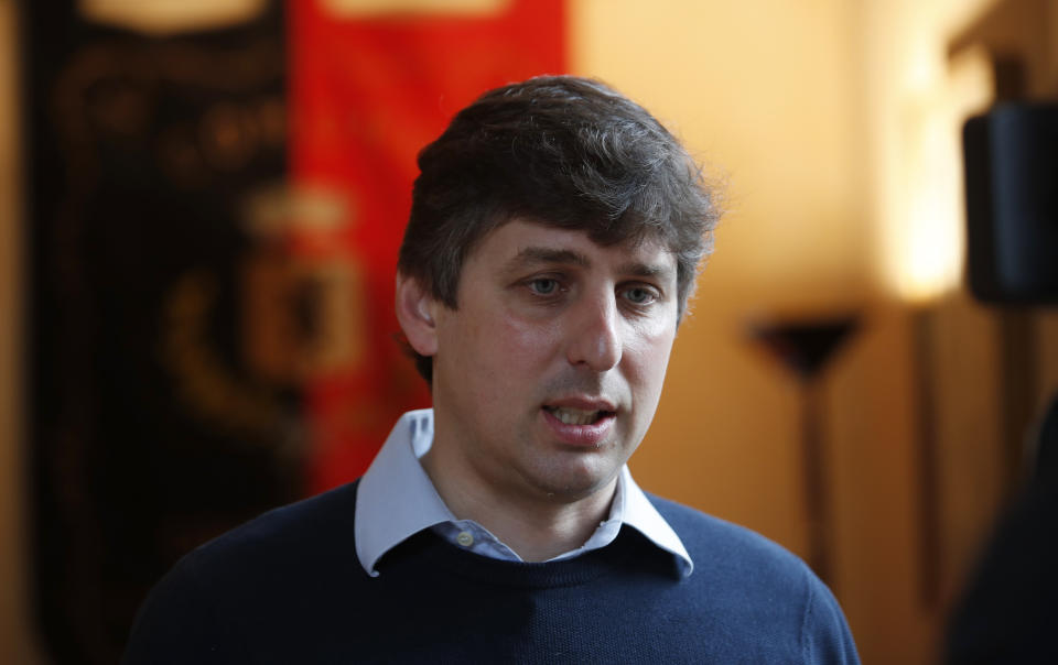 Courmayeur's major Stefano Miserocchi talks during an interview with The Associated Press, in Courmayeur, northern Italy, Thursday, Sept. 26, 2019. Italian officials sounded an alarm Wednesday over climate change due to the threat that a fast-moving melting glacier is posing to the picturesque Val Ferret valley near the Alpine town of Courmayeur. The Planpincieux glacier, which spreads 1,327 square kilometers (512 square miles) across the Grande Jorasses peak of the Mont Blanc massif, has been moving up to 50 centimeters (nearly 20 inches) a day (AP Photo/Antonio Calanni)