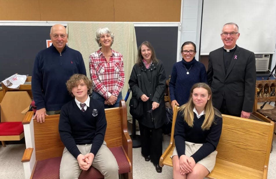 Among the numerous decisions to be made by Most Blessed Sacrament Church in Franklin Lakes is the seating style for new sanctuary pews. Members participating include (standing) rebuild chairman Frank Bivona, Karyn Mucks, Lauren Longo, Mary Anne Clark, Fr. John Job. Seated, Academy of the Most Blessed Sacrament Student Council president Lorenzo Guarino and vice president Devyn Nielsen.